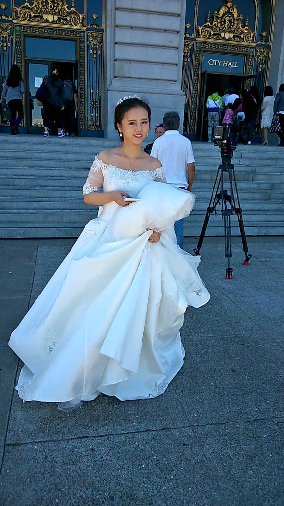 A lonely bride outside City Hall texting for help in San Francisco 