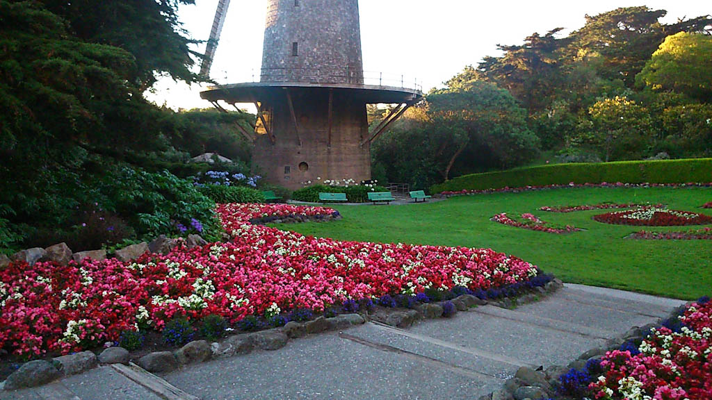 Windmill and beautiful gardens in the Golden Gate Park in San Francisco